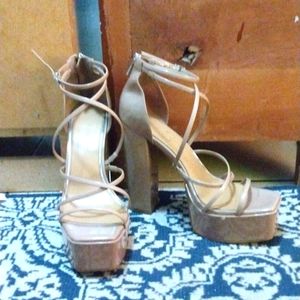 A Pair of Beige Open-Toe Heels